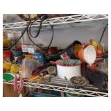 Items on shelf: funnels, screws, shears, washers, Chainsaw tools, and more.