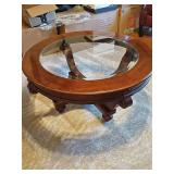 Round coffee table with glass insert. 40x19 in tall.