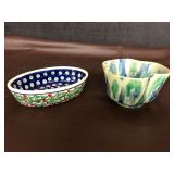 2 nice pieces of hand made pottery. Blue dot with holly leaves 6” L x 4” W Boleslawiec made in Poland. Multi colored bowl 4.5” W