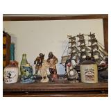 Items on top of bookcase. Two sailing ships, ironbird, other decorative items. See all photos. Bookcase not included.