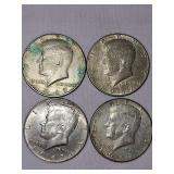 Four 1967 (40%) silver Kennedy half dollar coins.