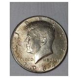 1964 silver Kennedy half dollar. No mint mark.