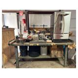 Metal shop table and contents…..includes KitchenAid ice machine, Ford tow hooks, dolly tires, paint supplies, cast iron bell with no clapper and more….72 x 30 x 35 tall