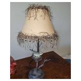 Branch look metal lamp with bird nest. 19in tall.