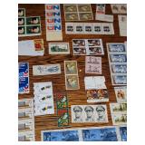 Stamp collectors: large lot of mostly uncirculated and a few circulated stamps