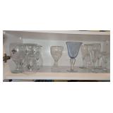 Collection of glasses on bottom shelf of  lass front cabinet to left of sink SEE ALL PICS...