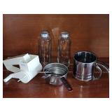 Zylizz cheese grater, stainless steel measuring cups, 5" glass salt n pepper shakers, and flour sifter