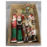 Assorted Santa Figurines, Candle Stands, and More