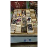 Box of football and baseball cards. Consigner