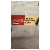 Metal Coca-Cola advertising sign. It