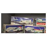 Five Hess Trucks, Cars And Airplane In The Box