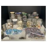 Assorted Colored Buttons in Glass Jars.