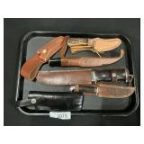 4 Hunting Knives, 2 Leather Sheathes.