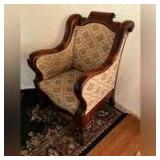 Large Victorian upholstered arm chair with rolled crest