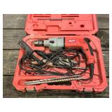 Milwaukee hammer drill with bits in case
