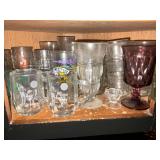 Assortment of glasses, sundae glasses, collectibles, Flintstones, Miss Piggy etc.