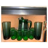 Green glass pitcher, juice and water glasses.