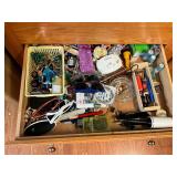 Junk drawer contents, scissors, stamps, pens & pencils