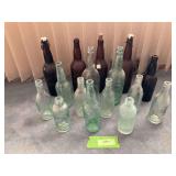 16 glass bottles all marked Cedar Rapids, IA