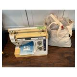 White sewing machine, bag of yarn