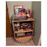 12D x 25L x 30H shelf with games, coloring books, books, hula hoop, etc