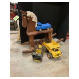 Wooden rocking horse and plastic dump truck