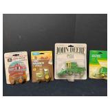 (4) John Deere 1:64 scale tractors/implements