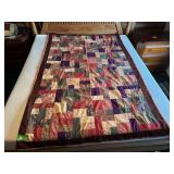 Flannel pieced blanket 56 x 88, one small tear See photos