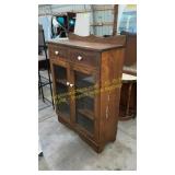 Wooden cupboard with glass doors