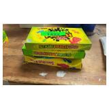 Pile of Swedish Fish & Sour Patch Kids Candy Boxes