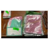 Pile of Kitchen Scrub Towels & Gift Bags