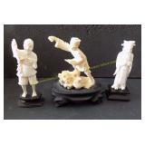 Three vintage Oriental figures on wood stands