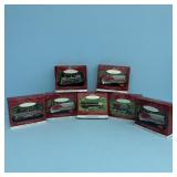 (7) HALLMARK HOLIDAY KEEPSAKE TRAIN ORNAMENTS