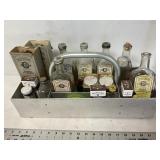 Vintage Watkins bottles and tins with carrier