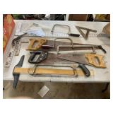 Assorted saws and squares. handsaws, coping saws,