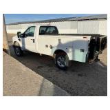 2010 Ford F250 Super Duty with utility box.