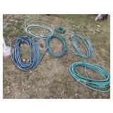 Assorted garden hoses, some repairs