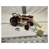 Farmall cub tractor with extension bucket,