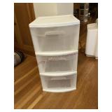 Three plastic storage drawers