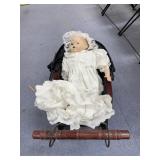 Porcelain Doll in Bassinet