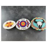 Three intricately beaded belt buckles in Native Am