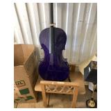 Lot with double sided chair, and a purple cello in