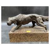 Bronze figurine of a dog on a heavy enameled cast