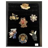 A hand selected grouping of fashion brooches: Tedd