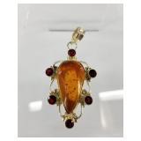 Sterling silver, garnet and amber pendant