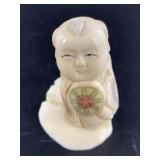 Asian ivory netsuke set on piece of walrus ivory 1