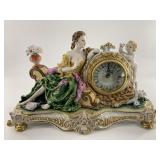 Porcelain French style mantel clock with lounging