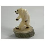 Very detailed carving of an upright polar bear on