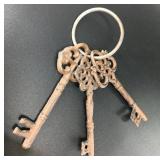 Set of three cast iron skeleton keys on a ring. Ea