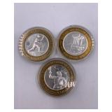 3 Silver gaming tokens